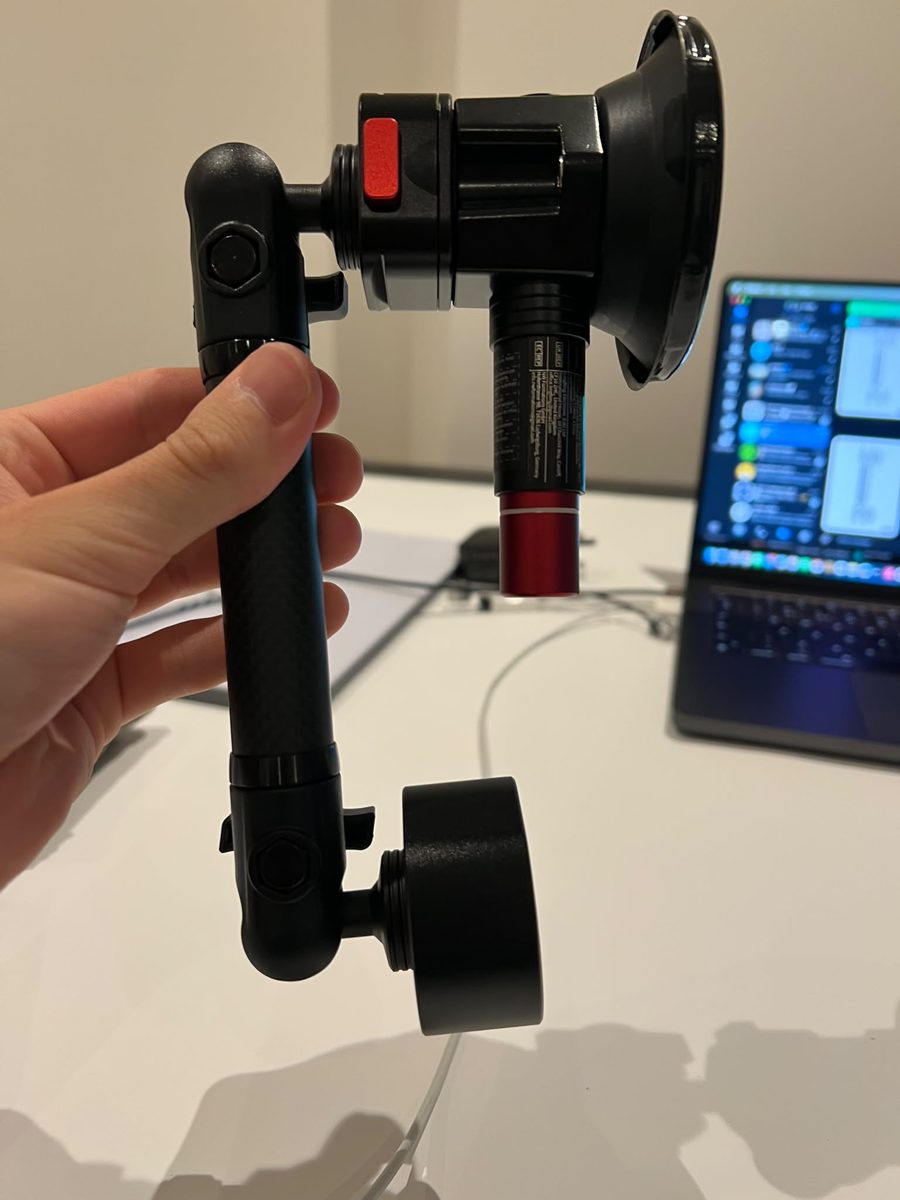 Arm and suction mount held in hand